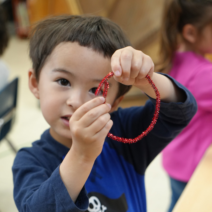 Child playing with toy.