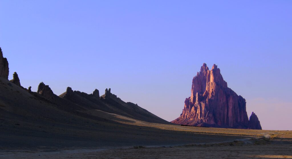 Shiprock rock formation on the Navajo Reservation in San Juan County, New Mexico, rising from the desert landscape