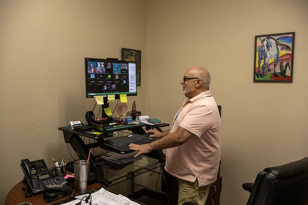 Joe Rivas participating in the Opioid Crisis and Pain Management ECHO program from his office in Farmington, NM