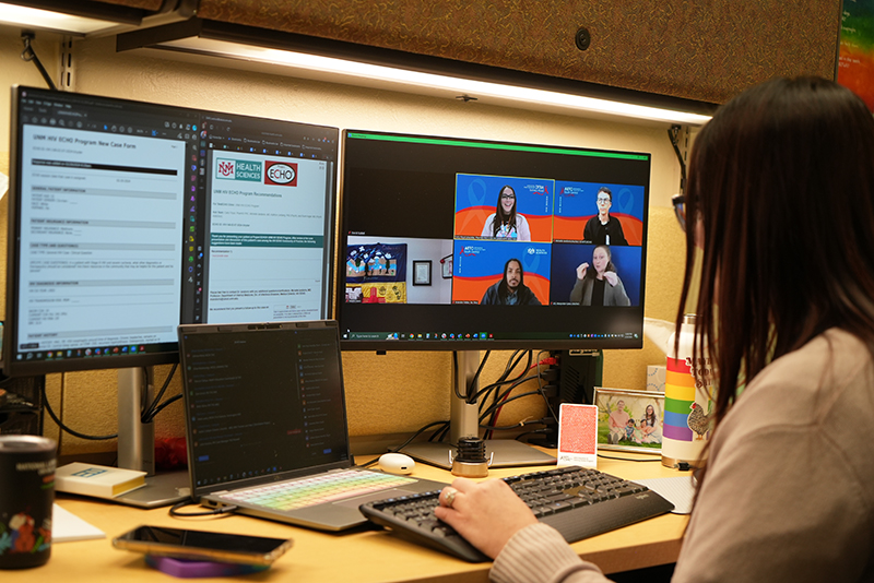 Side profile of an ECHO participant watching a live Project ECHO session on two computer screens.
