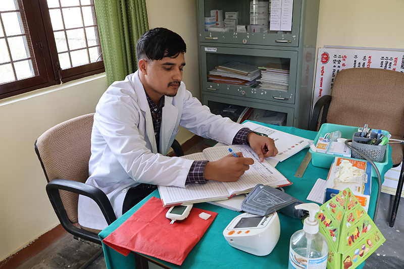 Community Health Officer Nitin Rawat at a health center in Badasi, Uttarakhand, delivering cancer care to rural patients.