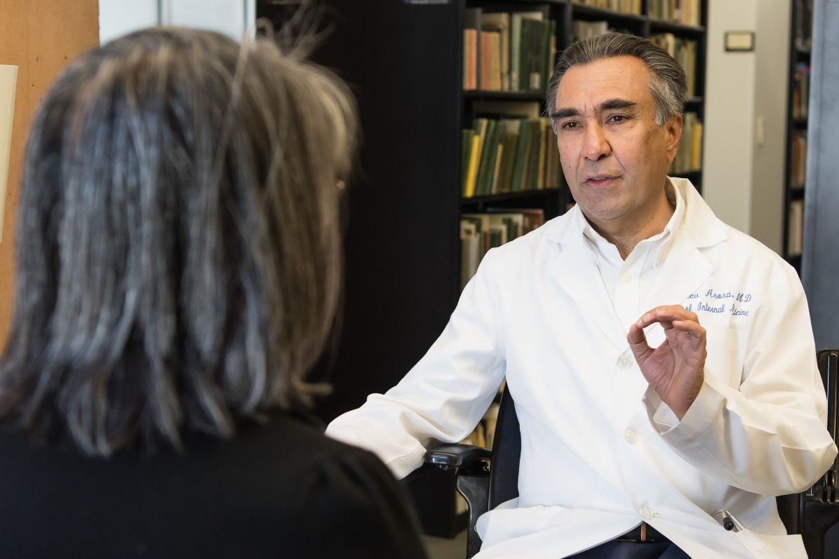 Dr. Sanjeev Arora talks to a patient