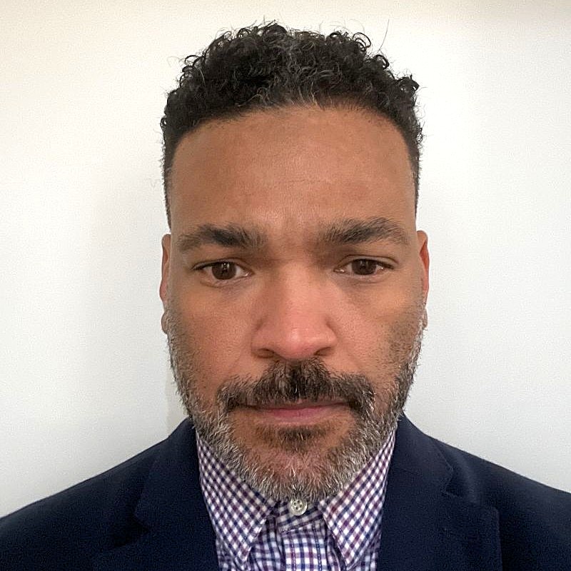 Headshot of Che Parker.