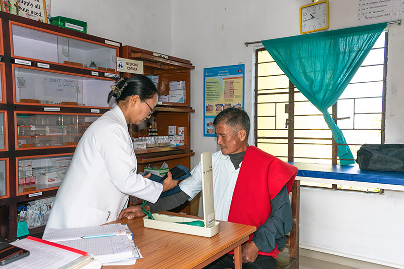 Close up shot of a gloved hand holding a syphilis test.