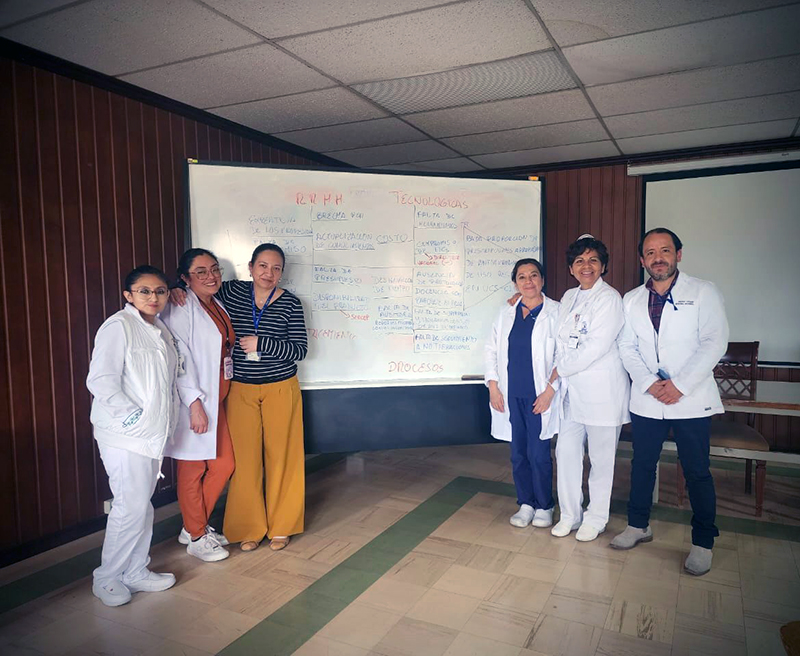 People in a detention center holding course completion certificates