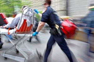 Emergency medical technician with patient